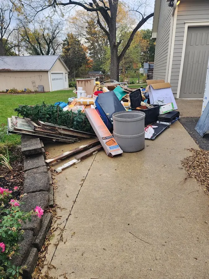 Dumpster being loaded with debris for Residential Dumpster Rental in Shallotte